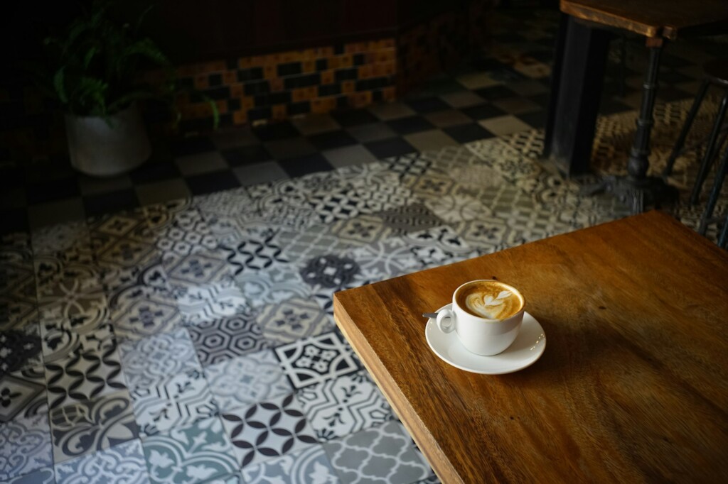 Cup of coffee on a wooden cafe table